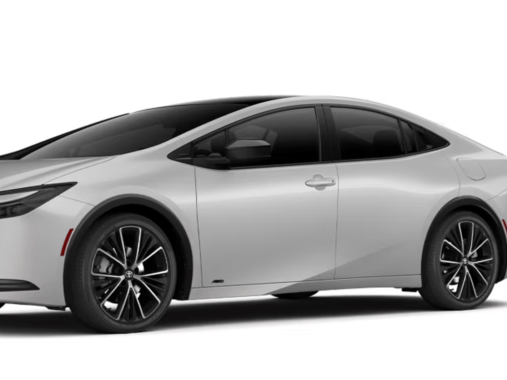 A silver Toyota Prius sedan is displayed in a three-quarter front view against a plain white background, with black alloy wheels and a dark panoramic roof panel visible.
